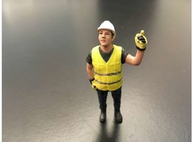 Figure Jaap hoisting Yellow safety jacket with helmet