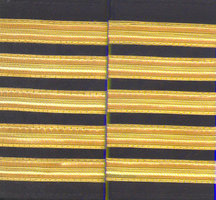 Set of two 5 gold bar Epaulettes with black background. ( 13 mm bar) 